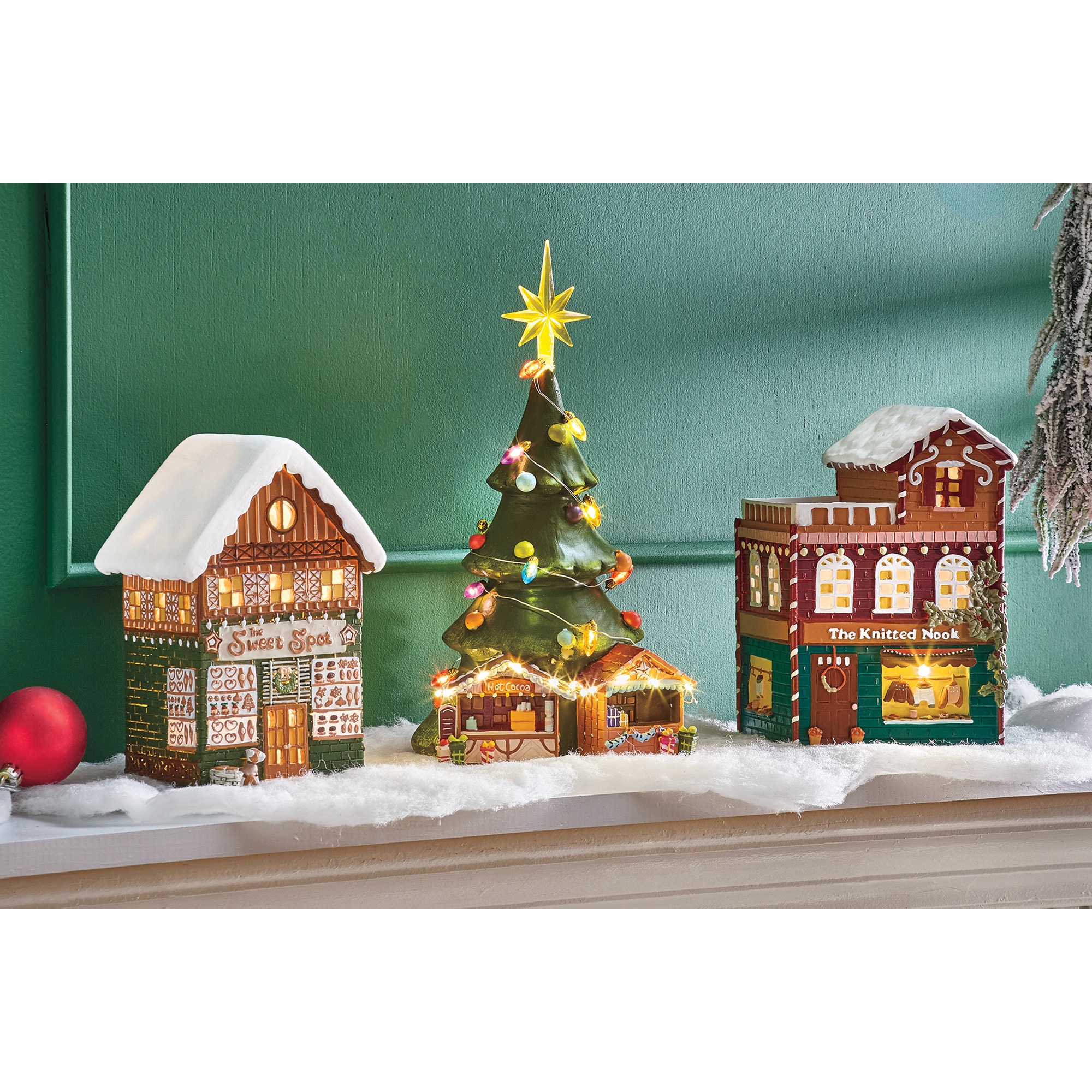 Lit Snowy Village Buildings