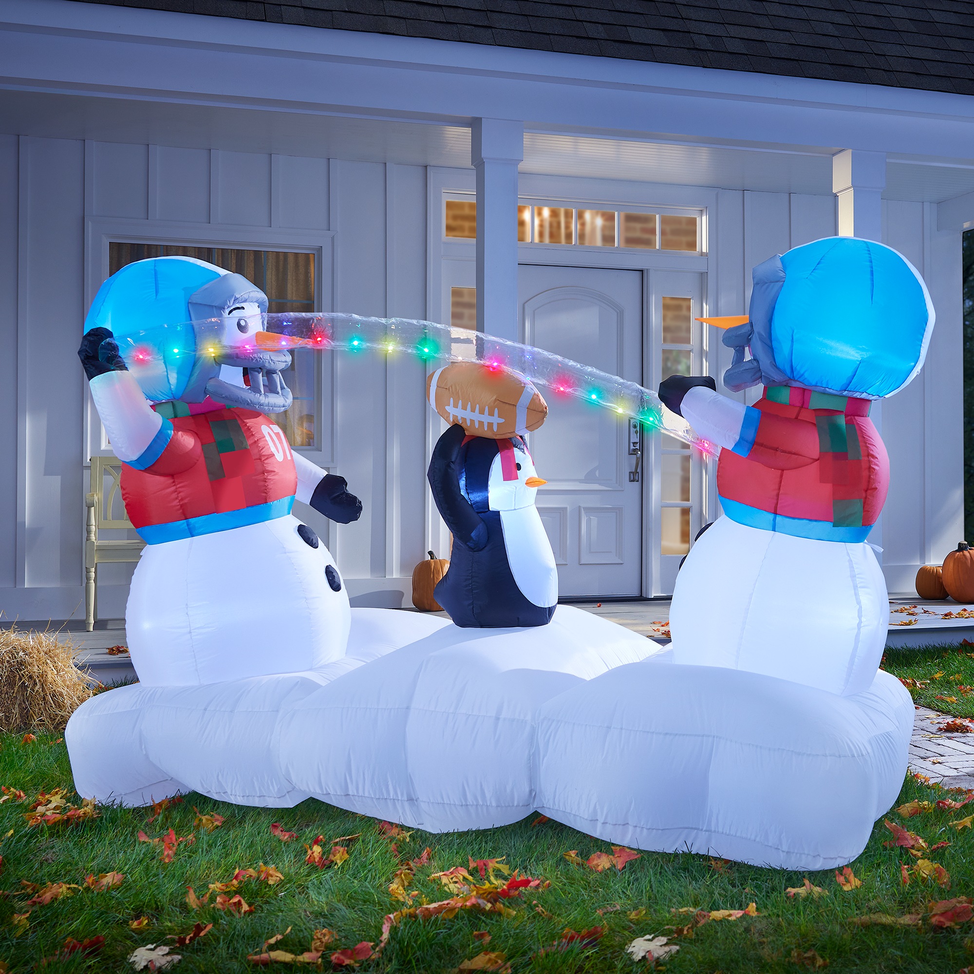 Lit Snowmen Playing Football Inflatable